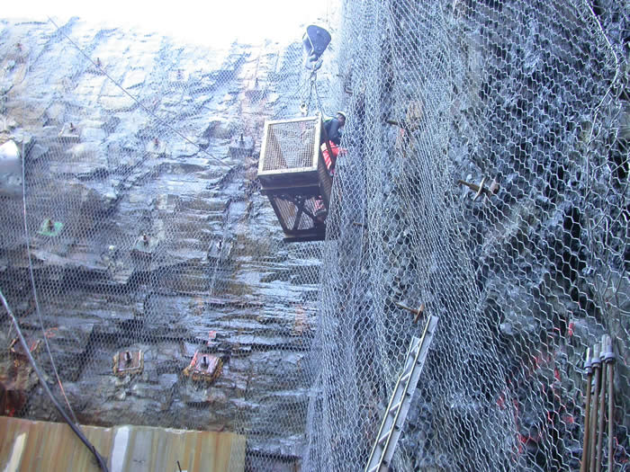 crews secure safety mesh to rock wall Halifax WTP wet well fall 2005