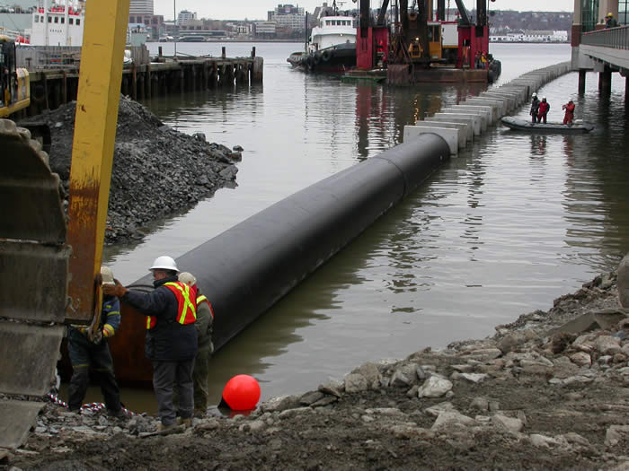 outfall pipe being placed in water